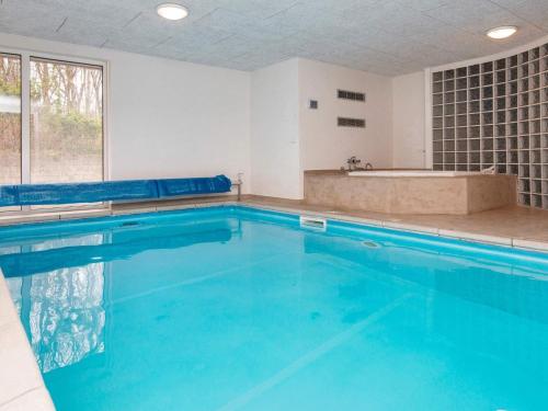 a large swimming pool with a tub in a bathroom at 10 person holiday home in Glesborg in Fjellerup Strand