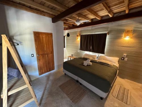 Postel nebo postele na pokoji v ubytování MARIBY HOLBOX