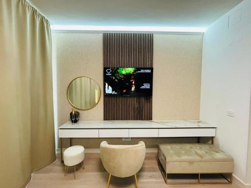 a dressing room with a mirror and a dressing table at Belgrade Waterfront-Beograd na vodi Galaxy Apartment in Belgrade