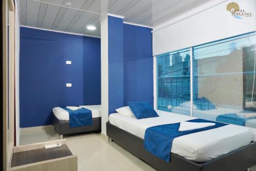 Postel nebo postele na pokoji v ubytování Hotel Perla del Caribe