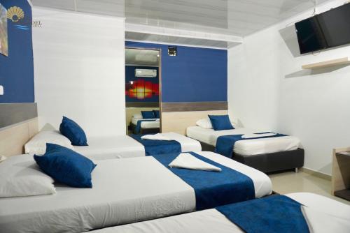 Postel nebo postele na pokoji v ubytování Hotel Perla del Caribe