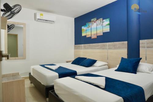 Postel nebo postele na pokoji v ubytování Hotel Perla del Caribe