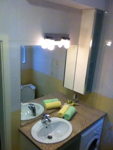 a bathroom with a sink and a mirror at Gogol 2BR Apartment in Sofia