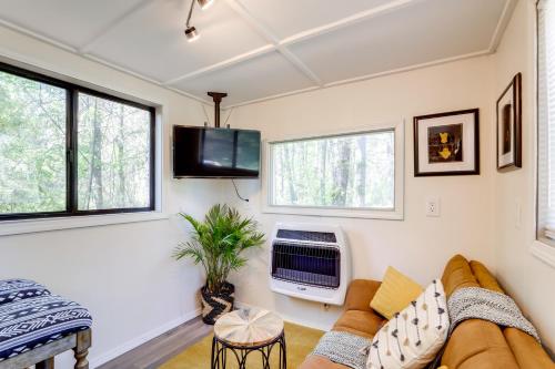 a living room with a couch and a tv at Hike On-Site Georgia Tiny Home on Farm Retreat in Lithonia