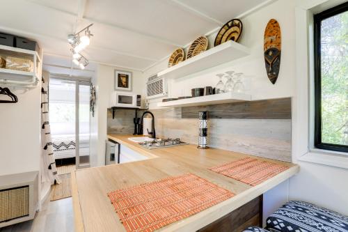 a kitchen with a wooden counter top in a tiny house at Hike On-Site Georgia Tiny Home on Farm Retreat in Lithonia