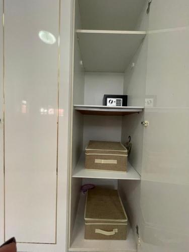 a walk in closet with two boxes and a microwave at Summer Diamond in Kremasti