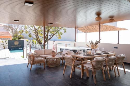 a dining room with a table and chairs at Magnolia Luxury Villa in Vieira de Leiria