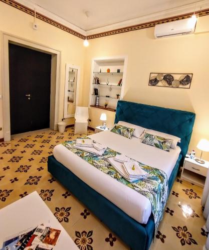 a bedroom with a large bed in a room at Suleima B&B Messina Centro in Messina