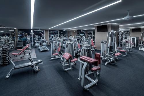 a gym with a bunch of machines in it at StripViewSuites at Palms Place in Las Vegas