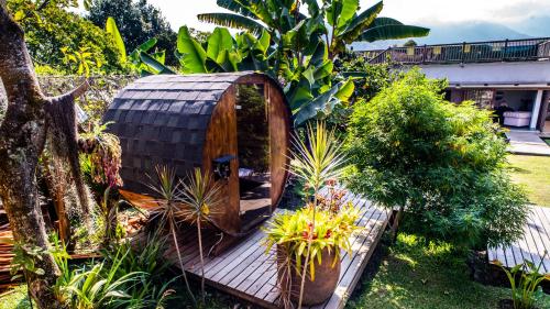 a tree house in the middle of a garden at Terasu Hotel Boutique Salento in Salento