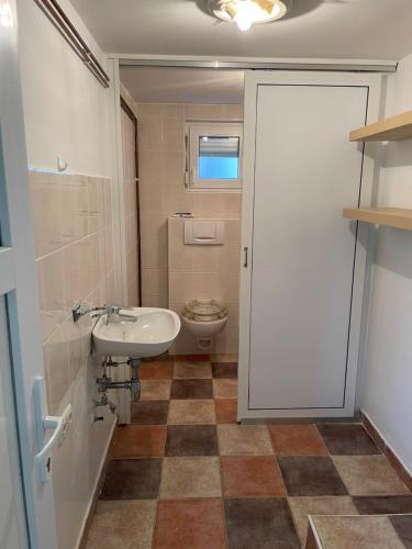 a bathroom with a sink and a toilet at 069 Riverside Vikendica - Banja Luka in Rekavice