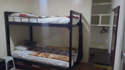 a couple of bunk beds in a room at Hotel La Posada in Belén de Umbría
