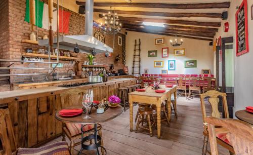 a restaurant with wooden floors and tables and chairs at Sonesta Posadas del Inca - Valle Sagrado Yucay Urubamba in Urubamba