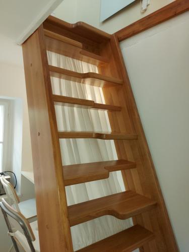 a wooden spiral staircase in a house at Haus Catull in Klosterneuburg