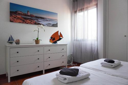 En eller flere senge i et værelse på Santiago Sun Beach