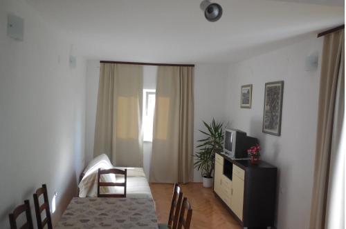 Postel nebo postele na pokoji v ubytování Apartments Maslina