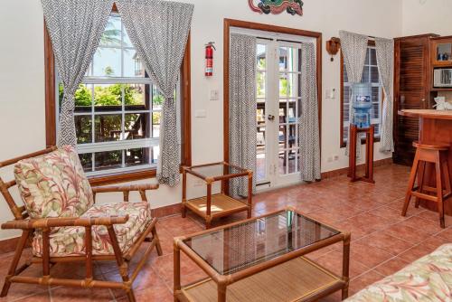 a living room with chairs and a table at X'tan Ha- The Waterfront in San Pedro