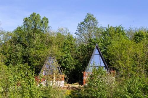 a pyramid house in the middle of a forest at Imanje Lotus Garden in Šabac
