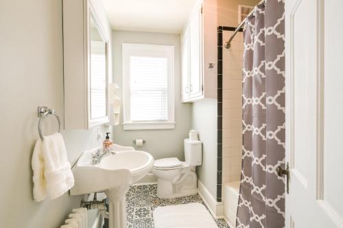 a bathroom with a sink and a toilet and a shower at Colorful Roanoke Vacation Rental with Hot Tub! in Roanoke
