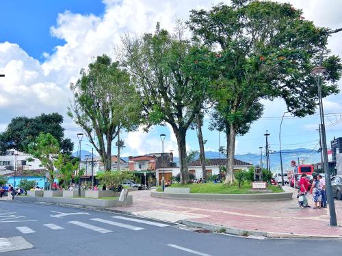 a street with trees on the side of a road at Acogedor Apartamento En La Circunvalar By Parceros Group in Pereira