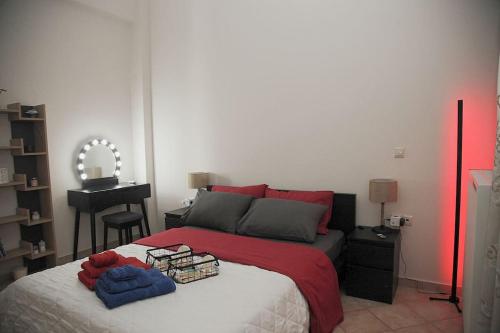 a bedroom with a bed with two towels on it at NK Dreamy Suite in Thiva