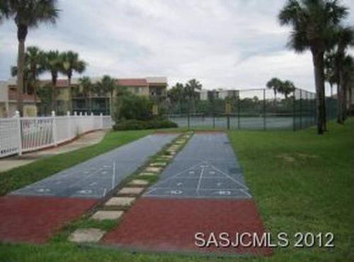 a driveway in a park with a tennis court at Beach Side complex B23 1 Bed 1 Bath w/Heated Pool in Saint Augustine