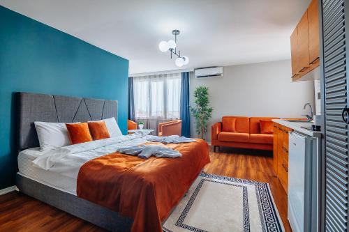 a bedroom with a bed with a blue wall at Taksim Wonder Suites in Istanbul