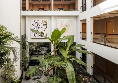 a view of therium of a building with plants at Cidnay Santo Tirso - Charming Hotel & Executive Center in Santo Tirso