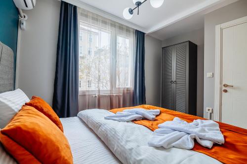 a bedroom with two towels on top of a bed at Taksim Wonder Suites in Istanbul