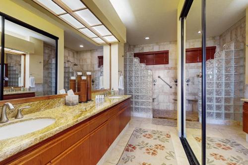 a bathroom with a sink and a shower at Shores at Waikoloa #323 in Waikoloa