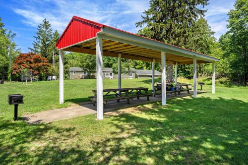 a picnic shelter with a red roof in a park at Jensen's RV Park and Motel in South Haven