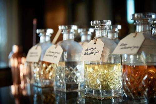 a group of bottles of whiskey on a table at One&Only Gorilla's Nest in Kinigi