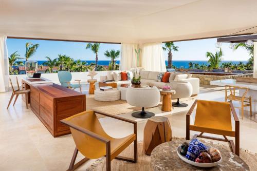 an open living room with a view of the ocean at One&Only Palmilla in San José del Cabo