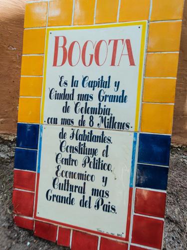 a sign that says boocco on a tile wall at BACANA CABAÑAS DE ALQUILER in Mazamitla