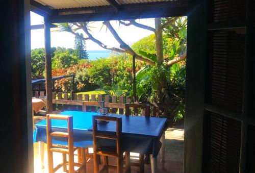 a blue table and chairs with a view of the ocean at Thalassa's in Port Shepstone