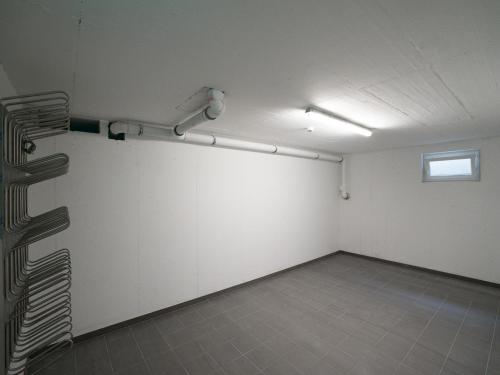 an empty room with a white wall and a window at Luxury Tauern Suite Walchen Kaprun 4 in Piesendorf