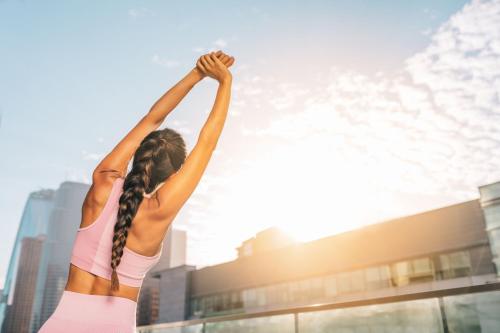 a woman with her arms up in the air at The Ritz-Carlton, Los Angeles L.A. Live in Los Angeles