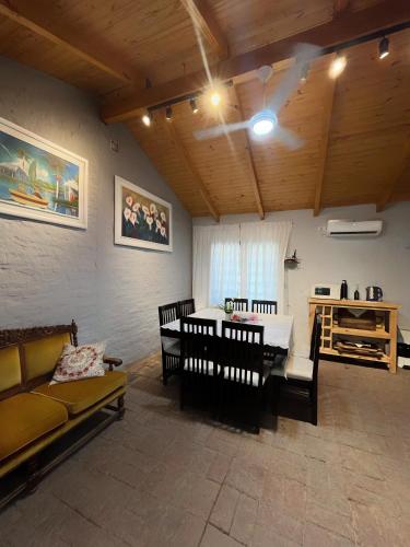 a living room with a couch and a table at Portal del Cachilito in Tres Marías