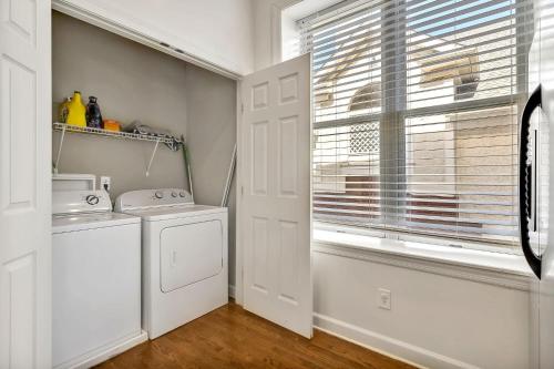 a laundry room with a washing machine and a window at Nashville - 931 Russell St Apt D in Nashville