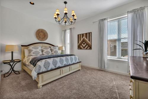 a bedroom with a bed and a chandelier at Nashville - 931 Russell St Apt A in Nashville