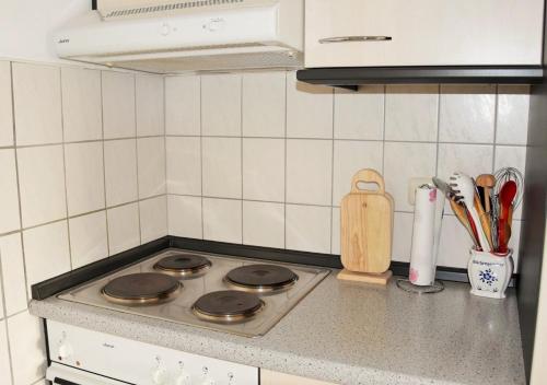 a kitchen counter with a stove top in a kitchen at Ferienwohnung Rodachtalblick 927 in Bad Rodach