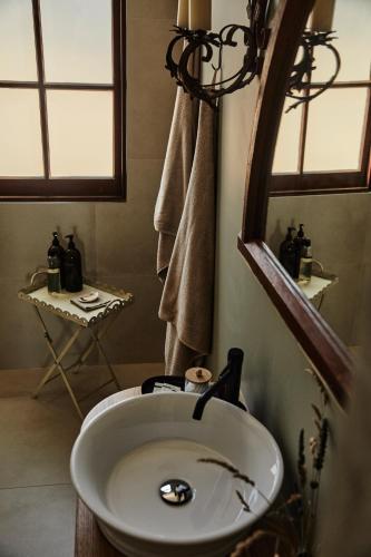 a bathroom with a sink and a mirror at St Martins of Tasmania - converted heritage listed church in Dunalley