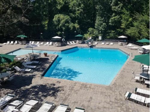 an overhead view of a swimming pool with lounge chairs at Stairway to Heaven - 3 Master Suite, Location, Privacy, Firepit in Gatlinburg