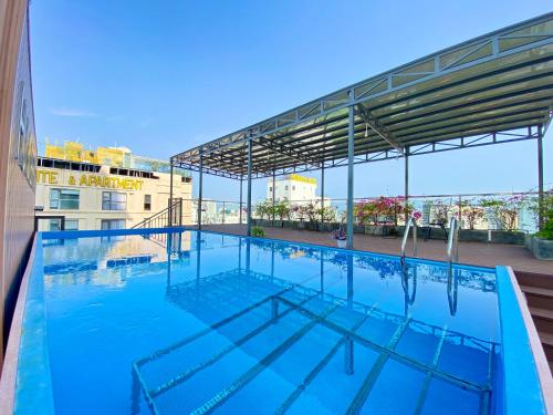 a large swimming pool on top of a building at Hummer Hotel & Apartment Da Nang Beach in Da Nang