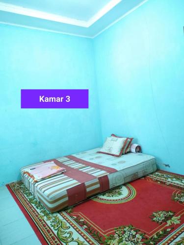 Postel nebo postele na pokoji v ubytování Homestay Mutiara Syariah