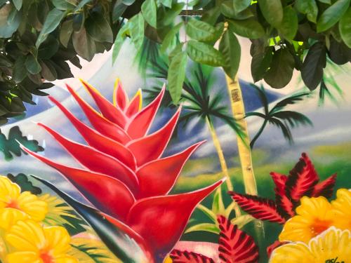 a painting of a red flower in the jungle at residence caramboles in Fort-de-France