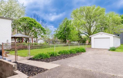 a house with a fence and a driveway at The Richmond - Fair Expo, Derby, YUM in Louisville
