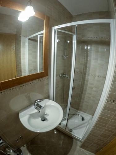a bathroom with a sink and a shower at Apartments Car in Rab