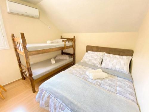 Postel nebo postele na pokoji v ubytování Aconchego do Valle