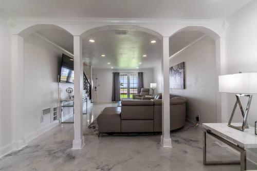 a living room with a couch and a table at Ocean Drive Splendor Awaits in Corpus Christi